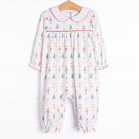 Our Sugar Plum Fairy romper features snaps at the stride for an easy change, red picot, and the cutest Nutcracker print.