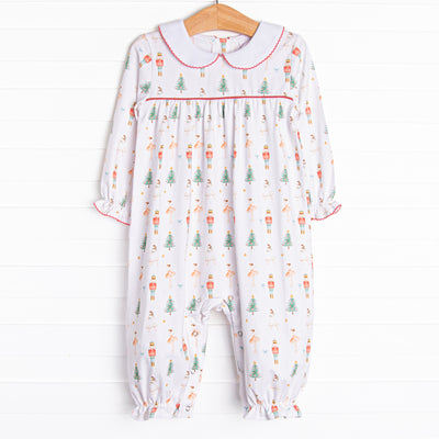 Our Sugar Plum Fairy romper features snaps at the stride for an easy change, red picot, and the cutest Nutcracker print.