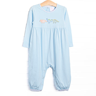 This romper features blue knit fabric, dinosaur appliques, and snaps along the stride to make changing a breeze.