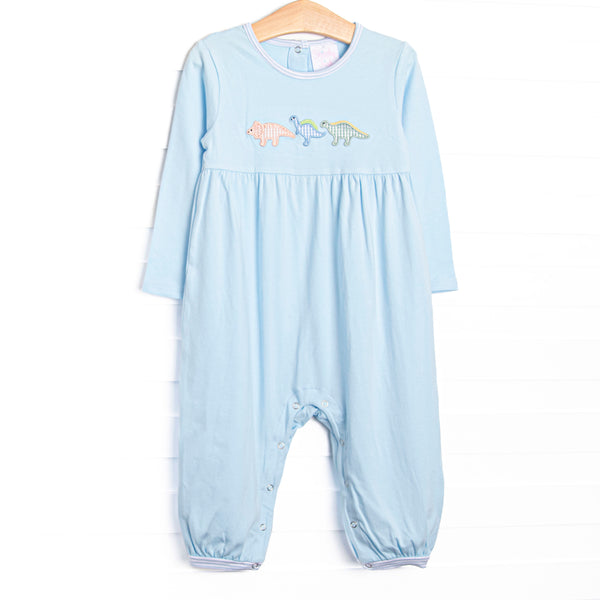 This romper features blue knit fabric, dinosaur appliques, and snaps along the stride to make changing a breeze.