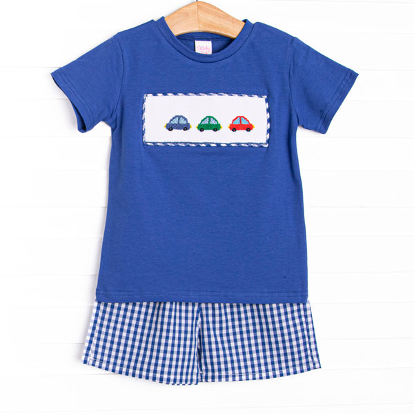 This set&nbsp; features a royal blue short sleeve top with trio of cars smockings and blue gingham shorts to match.