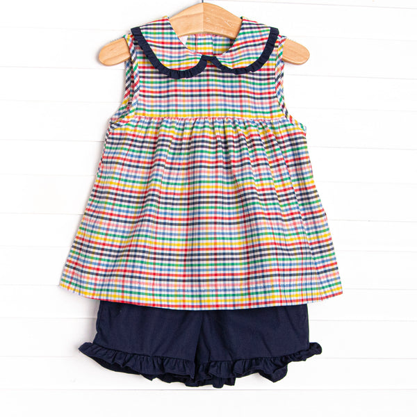 This set features a plaid print, a navy blue ruffle collar, and coordinating navy blue ruffle shorts to match