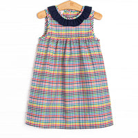This dress features a plaid print, button closure on the back, and a navy blue ruffle collar