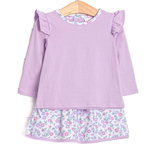 This set features a purple top, flutter shoulders, and a floral skirt to match.