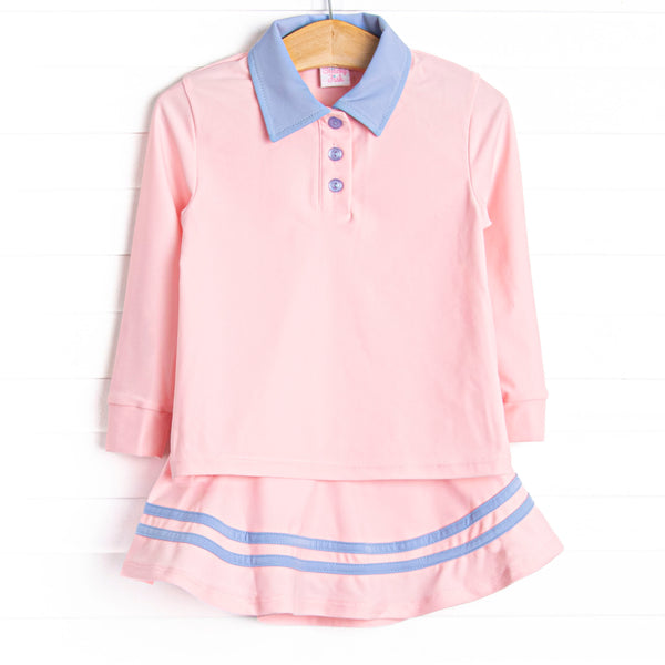  This set features a pink material, a blue collar, the best performance fabric and a coordinating skort. 