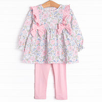 This set features a long sleeve top in a pink floral print with pink ruffles and bows. Coordinating pink knit leggings to match
