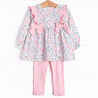 This set features a long sleeve top in a pink floral print with pink ruffles and bows. Coordinating pink knit leggings to match