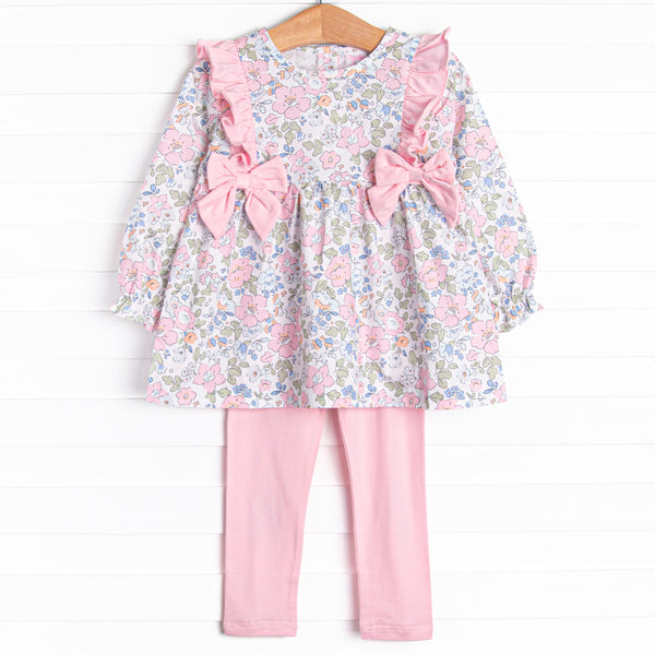 This set features a long sleeve top in a pink floral print with pink ruffles and bows. Coordinating pink knit leggings to match