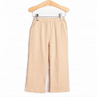  It features straight cut legs with pockets for all of your little guy's tiny treasures. Featured in four colors: Tan, Blue, Navy and Red. 
