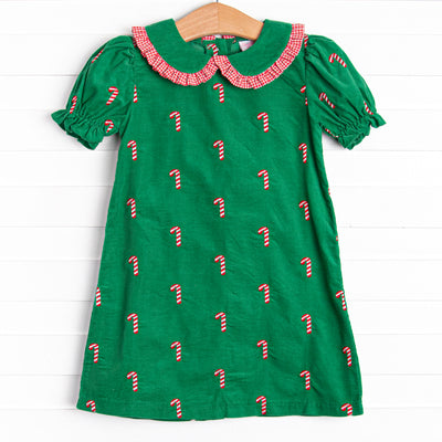 This dress features a green corduroy, puff sleeves, and candy cane embroideries
