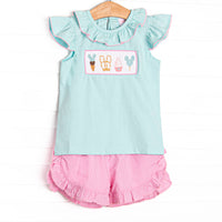  This set features a mint green flutter sleeve top with a magical treat smocking and ruffle collar