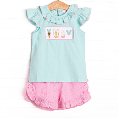  This set features a mint green flutter sleeve top with a magical treat smocking and ruffle collar
