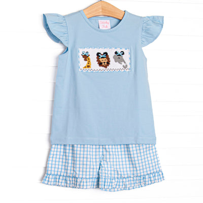  This set features a blue flutter sleeve top with a jungle animal smocking with mouse ears and blue check print ruffle shorts to match. 