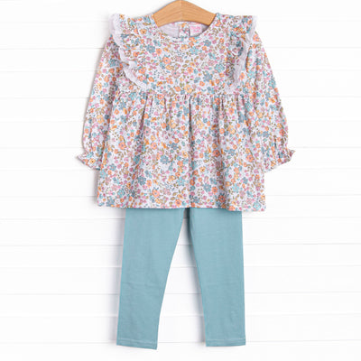 This set features a blue floral print, eyelet lace trim, and blue leggings to match.