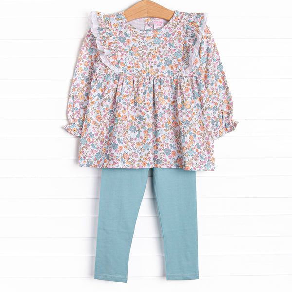This set features a blue floral print, eyelet lace trim, and blue leggings to match.
