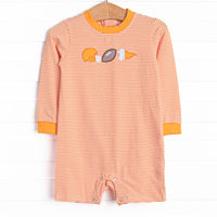 This romper features a orange striped print, snaps on the stride, and a football applique.