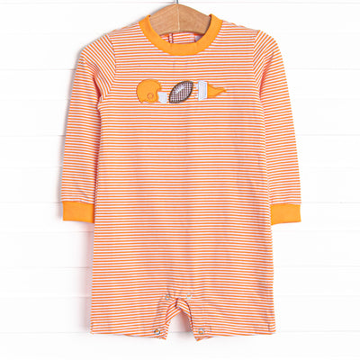 This romper features a orange striped print, snaps on the stride, and a football applique.