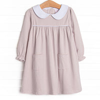 A tan stripes, pockets and piping at the chest 