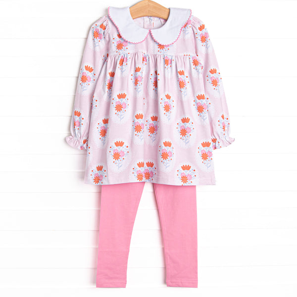 This set features a pink floral print, a scalloped collar, and pink leggings to match.
