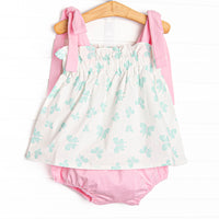 This set features an butterfly print, elastic trim, and pink shoulder ties. Coordinating pink diaper cover to match.