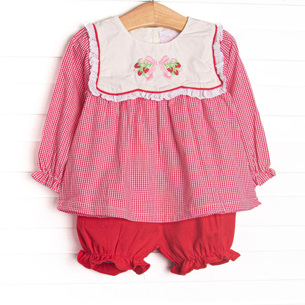 This set features red gingham fabric, a white bib collar, and strawberry and bow embroidery. Coordinating red bloomer shorts to match.