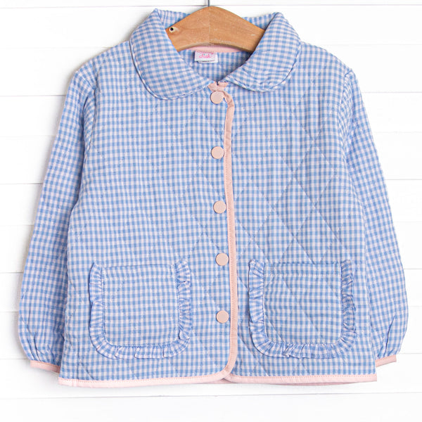 This coat features a blue gingham quilted material, a peter pan collar, and pink buttons.