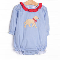  This bubble features blue gingham fabric, a red ruffle collar, and a puppy applique. 