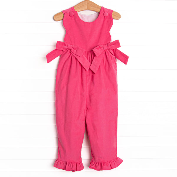  Featured in a hot pink color, with bow details on the sides and snaps along the stride. 