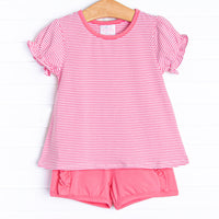The&nbsp;set features a pink stripe top, the softest knit material, and pink&nbsp; ruffle shorts to match.
