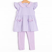 The&nbsp;set features purple stripes, ruffle trim, and purple knit leggings.