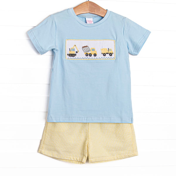 This set features a blue short sleeve top with a construction smocking and yellow seersucker shorts to match.