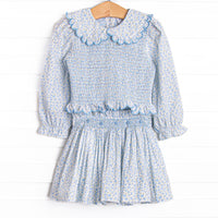  Bleu features a beautiful combination of timeless elegance and charm, curated with intricate details and crafted from premium fabrics! This set features a blue floral fabric, dainty smocking , and beautiful scalloped trimmed peter pan collar. 