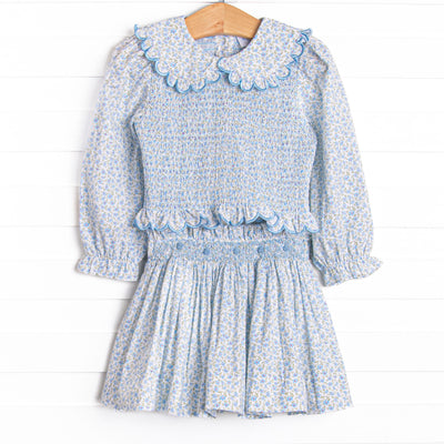  Bleu features a beautiful combination of timeless elegance and charm, curated with intricate details and crafted from premium fabrics! This set features a blue floral fabric, dainty smocking , and beautiful scalloped trimmed peter pan collar. 