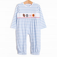  A long knit blue striped romper with a football, soccer ball, baseball and basketball smocking.&nbsp; 