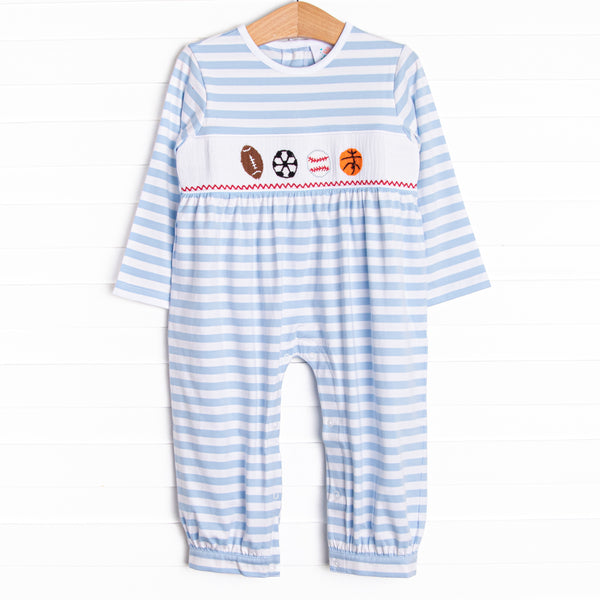  A long knit blue striped romper with a football, soccer ball, baseball and basketball smocking.&nbsp; 