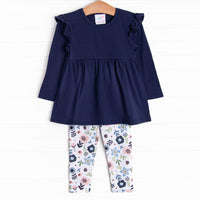 The set features a long sleeve shirt, coordinating leggings, and soft knit material.