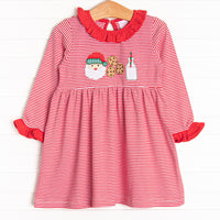  Our Santa's Treat Trio Dress includes red stripes, coordinating ruffle around the neck, and the cutest Christmas applique. 