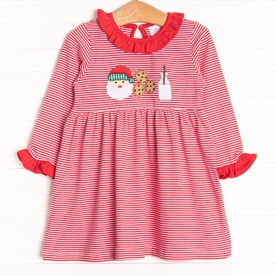  Our Santa's Treat Trio Dress includes red stripes, coordinating ruffle around the neck, and the cutest Christmas applique. 