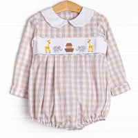  This long sleeve romper is featured in a tan gingham print with a white peter pan collar and a Noah's Ark smocking. 