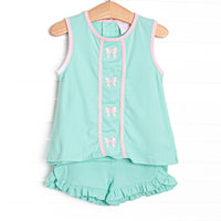  This set features a mint green knit material, pink trim, and pink bows embroidery. 