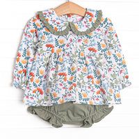  The Emily Collared Diaper Set is featured in adorable green, orange and yellow floral print with long sleeves, Peter Pan collar, and coordinating green diaper cover. 
