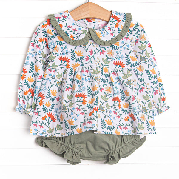  The Emily Collared Diaper Set is featured in adorable green, orange and yellow floral print with long sleeves, Peter Pan collar, and coordinating green diaper cover. 