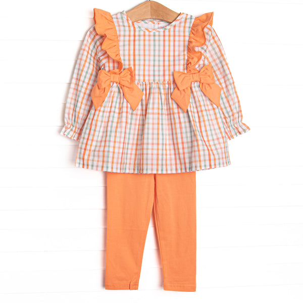  This set features an orange plaid print, orange bows, and coordinating orange leggings to match. 