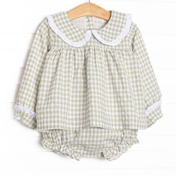 This set is featured in a green gingham print, a peter pan collar with a ruffle detail. Matching diaper cover to complete the set.
