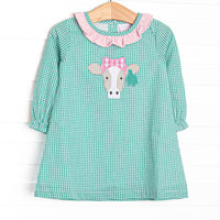 This dress features mint green gingham, a pink ruffle collar, and a cow applique