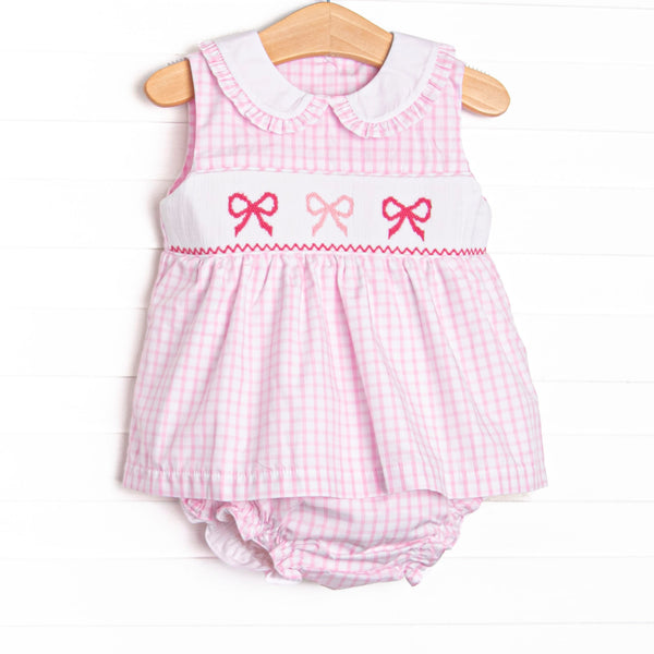 This set features a pink gingham design, bow smocking, and a ruffle trimmed collar.