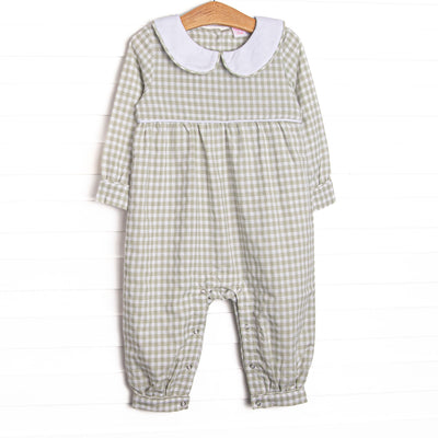 This romper is featured in green gingham print, with a peter pan collar and snaps on the stride to make changing a breeze.