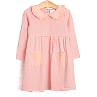 This dress features a peach stripes, front pockets, and a peter pan collar with ruffle trim.