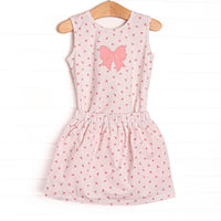 This set features a dainty pink floral print, pink bow applique and matching skirt. 