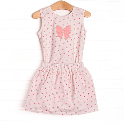  This set features a dainty pink floral print, pink bow applique and matching skirt. 
